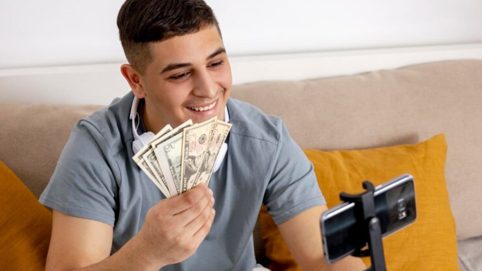 young-man-blogger-recording-lifestyle-blog-talking-camera-smartphone-tripod_1048944-8187253